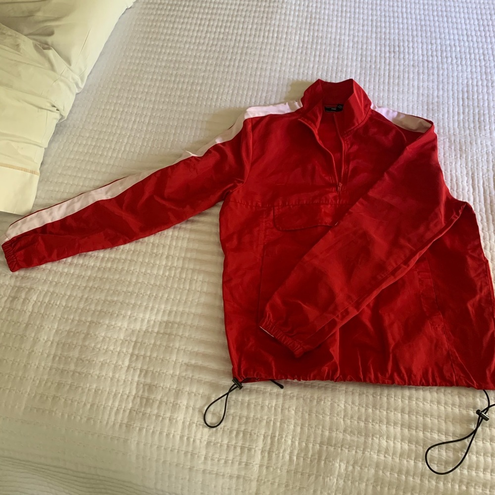 Red windbreaker with white stripe